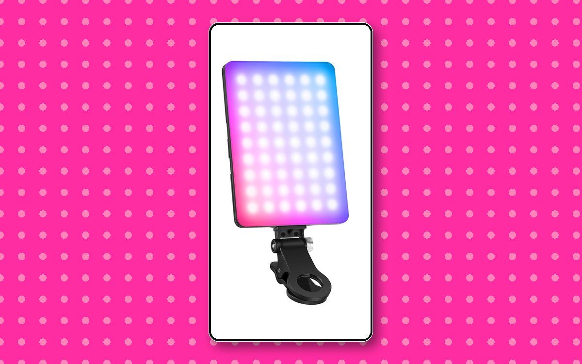 Clip-on RGB selfie light panel lit in pink and blue with its adjustable clamp